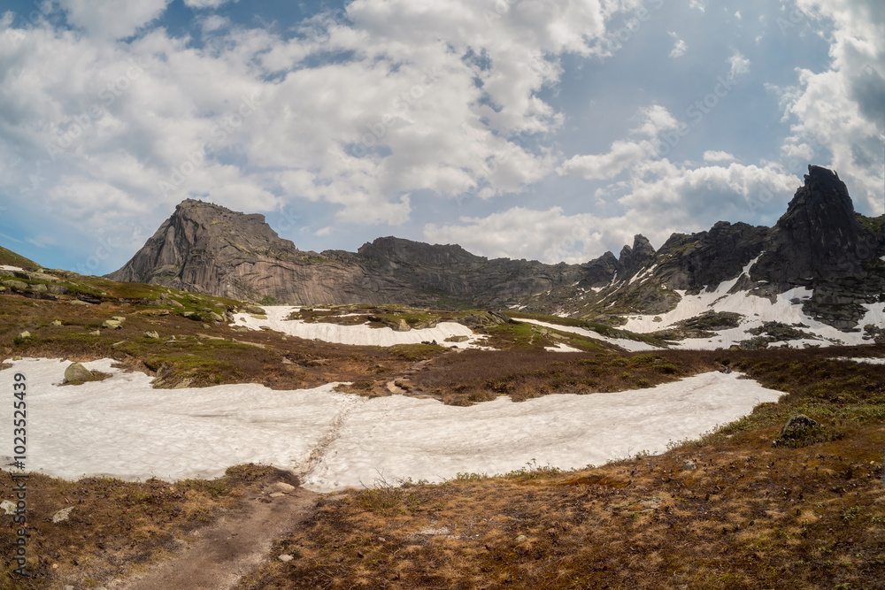 A hiking trail across the plateau to the far cliff. A hiking trail across the plateau to the far cliff.