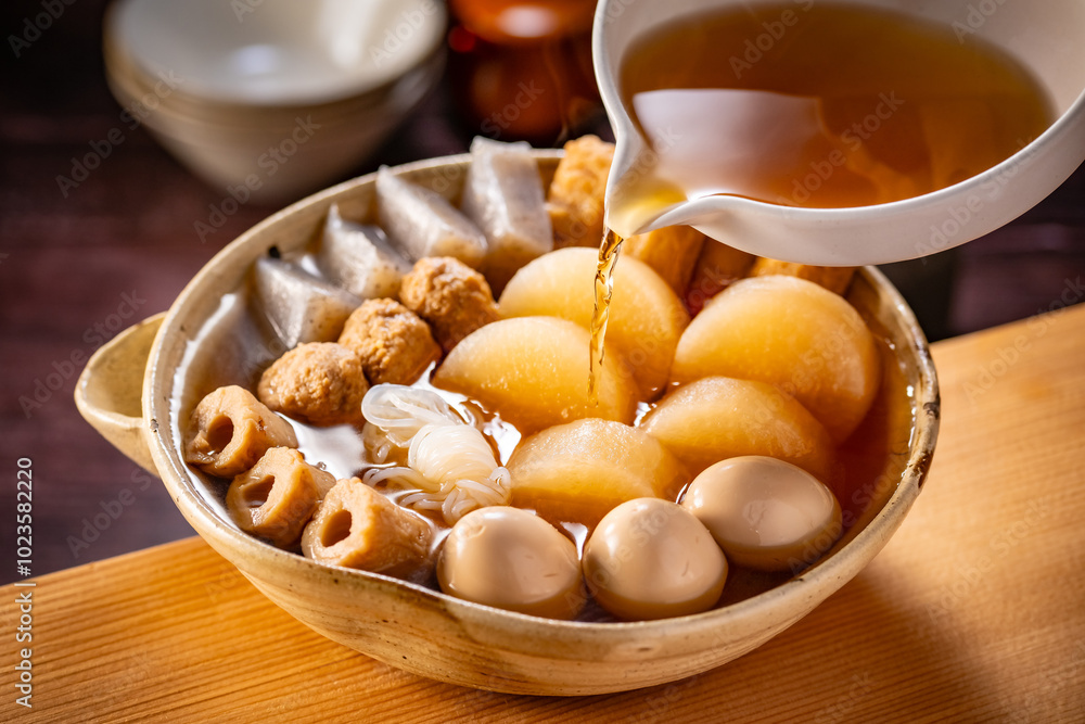 Japanese Oden, fish cake and vegetable stew.
Oden is a stew made with boiled eggs, radish (daikon), fish cakes and stock (dashi). Japanese Oden, fish cake and vegetable stew.
Oden is a stew made with boiled eggs, radish (daikon), fish cakes and stock (dashi).