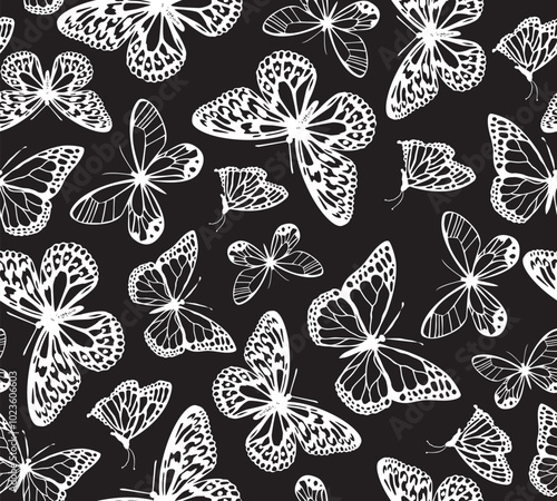 Seamless butterfly silhouette pattern. Repeating vector print with a variety of white butterflies on a black background. Apparel textile pattern.