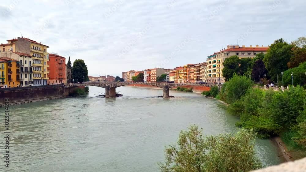 Verona - Italy - View of the Ponte Nuovo in cloudy weather Verona - Italy - View of the Ponte Nuovo in cloudy weather