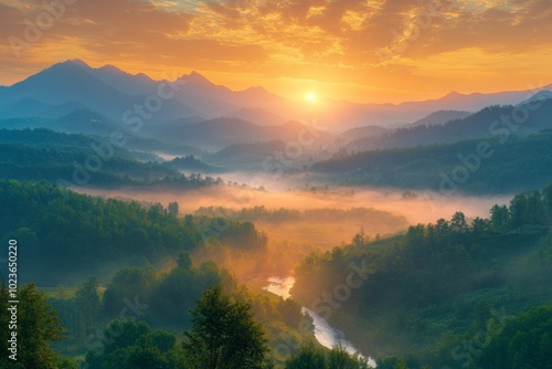 Golden sunrise illuminating foggy valley in the mountains