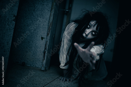 Portrait of asian woman make up ghost,Scary horror scene for background,Halloween festival concept,Ghost movies poster,angry spirit in the apartment photo