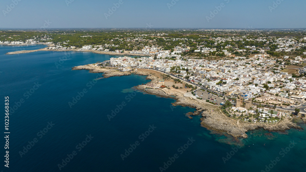 Obraz premium Aerial view of Santa Maria al Bagno, hamlet of the municipality of Nardò in Salento, Puglia, Italy. It's a small tourist town famous for its four columns on the sea, ruins of an ancient fortification.