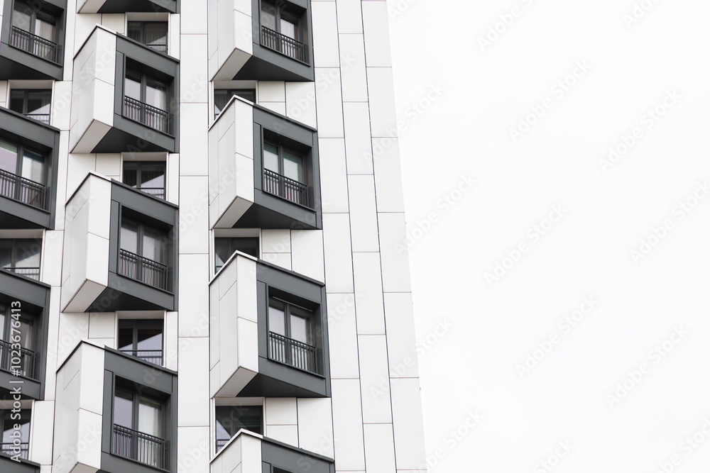 Modern high-rise apartment buildings with distinctive balconies in a residential area showcasing urban living Modern high-rise apartment buildings with distinctive balconies in a residential area showcasing urban living