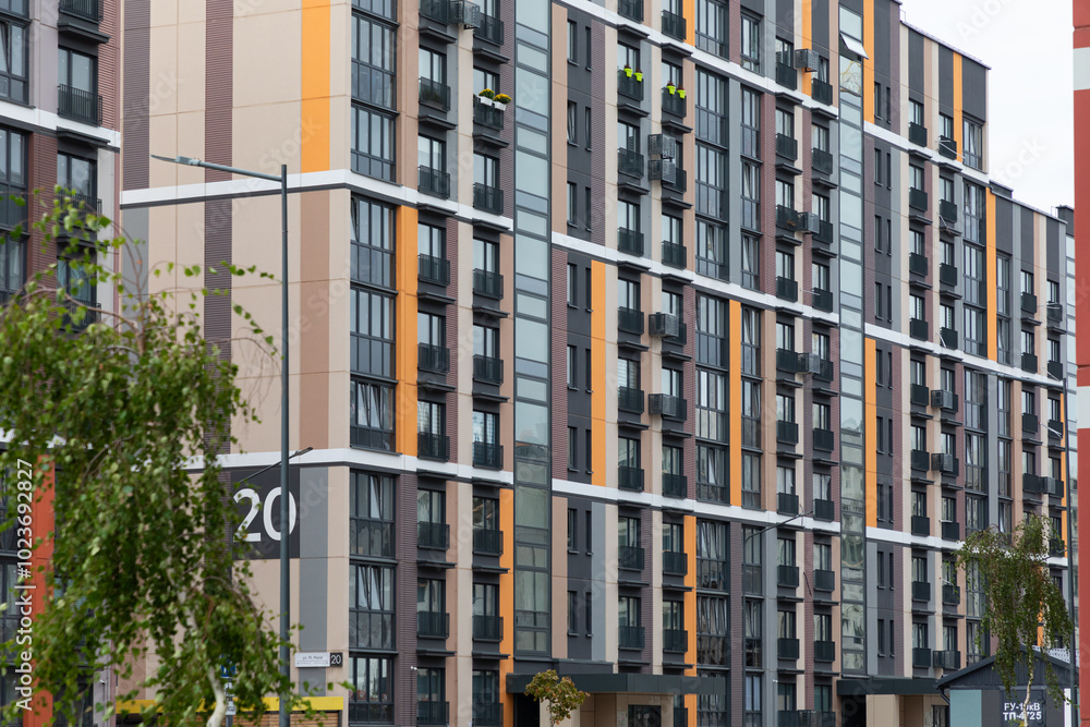 Fototapeta premium Modern high-rise apartment buildings in a vibrant residential area designed for urban living and sustainable housing solutions