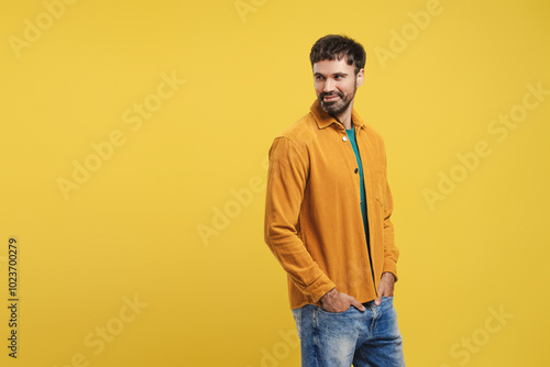 Portrait of handsome Hispanic man, fashion model wearing stylish casual clothes, hands in pocket