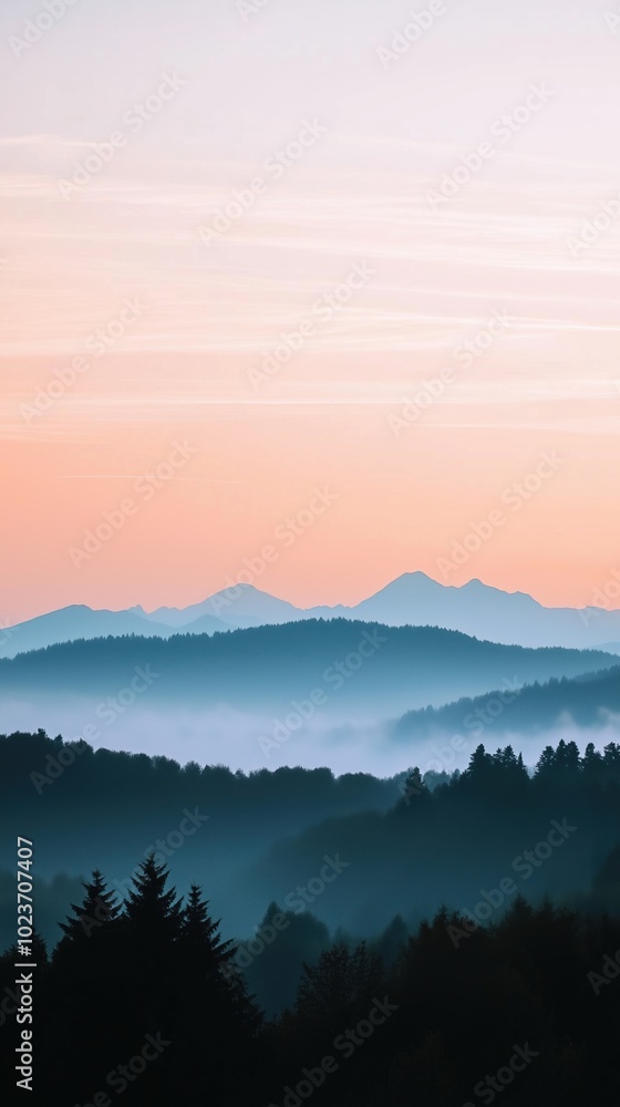 A beautiful mountain range with a pink and orange sky in the background A beautiful mountain range with a pink and orange sky in the background