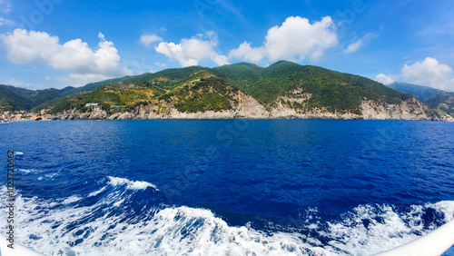 Cinque Terre, Liguria, Italy - August 5th 2024: View of the sea and a cliff in Cinque Terre from a boat photo