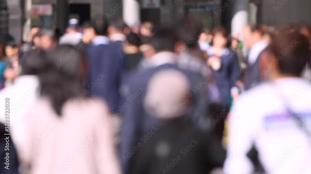 Blurry People in Tokyo City. Business District. Rush Hour Time People Are Walking on the Sidewalk. Japanese People Blurry People in Tokyo City. Business District. Rush Hour Time People Are Walking on the Sidewalk. Japanese People