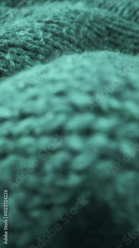 Extreme detail view of sheep wool cloth texture in macro dolly shot. Flowing animal fiber material for handcraft knitting. Textile abstract background. Winter fashion clothing industry concept. photo