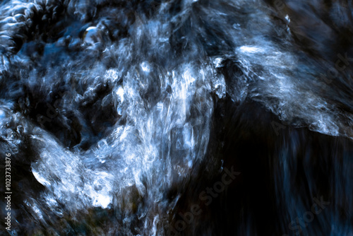 Abstract swirling water patterns in dark tones