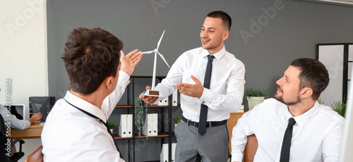 Male engineers with windmil...