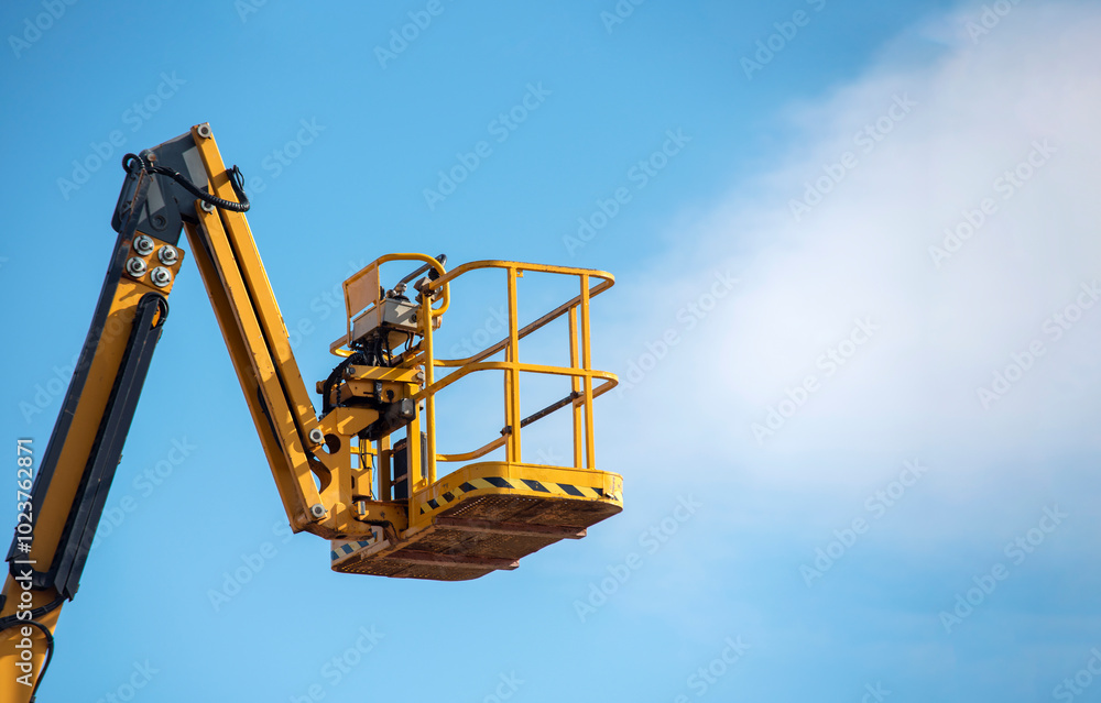 custom made wallpaper toronto digitalA bright yellow lift stretches towards the sky during a clear day, ready for workers to reach great heights