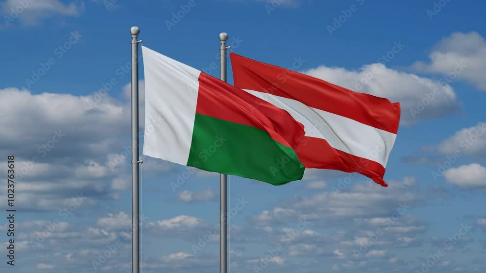 Austria and Madagascar flags flying together, video concept of the relationship, two country relations concept Austria and Madagascar flags flying together, video concept of the relationship, two country relations concept