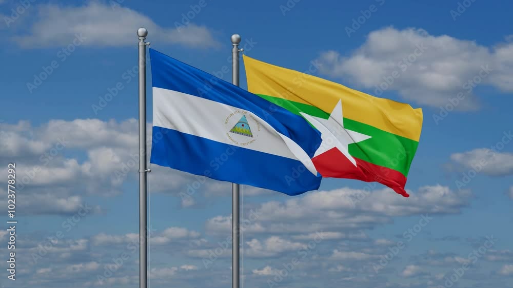 Myanmar aka Burma and Nicaragua flags flying together, video concept of the relationship, two country relations concept Myanmar aka Burma and Nicaragua flags flying together, video concept of the relationship, two country relations concept