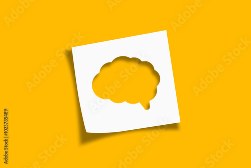 Mental health and problems with memory. Human brain shaped cut out on white note paper on yellow background. photo