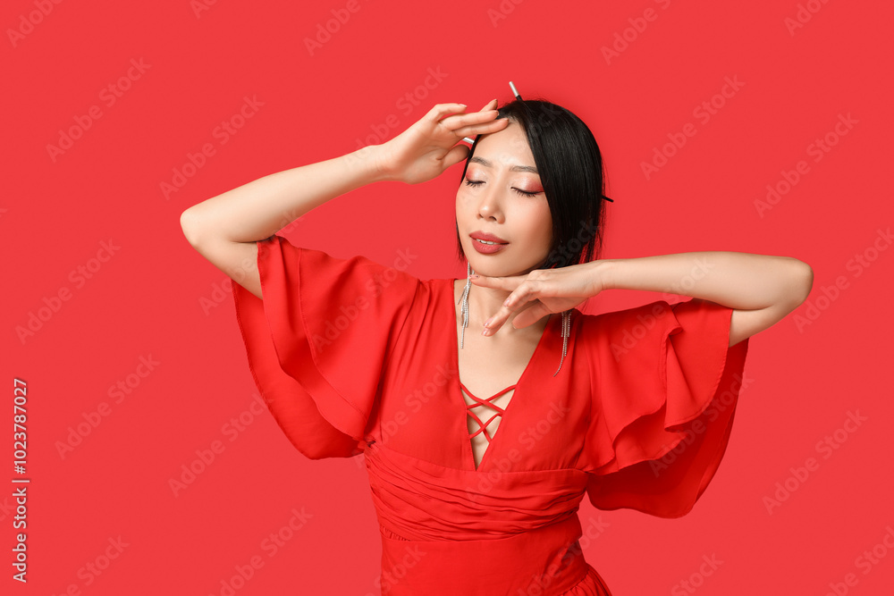Beautiful young stylish Asian woman on red background. Chinese New Year celebration Beautiful young stylish Asian woman on red background. Chinese New Year celebration