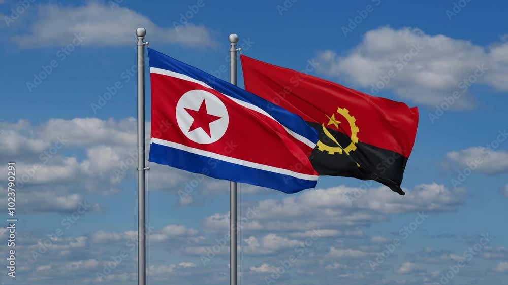 North Korea and Angola flags flying together, video concept of the relationship North Korea and Angola flags flying together, video concept of the relationship
