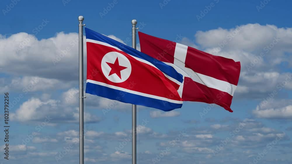 Denmark and North Korea flags flying together, video concept of the relationship, two country relations concept Denmark and North Korea flags flying together, video concept of the relationship, two country relations concept