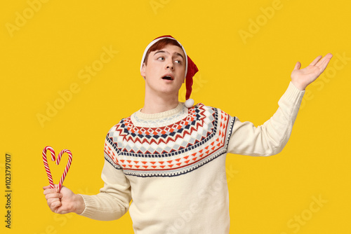 Surprised young man in warm...