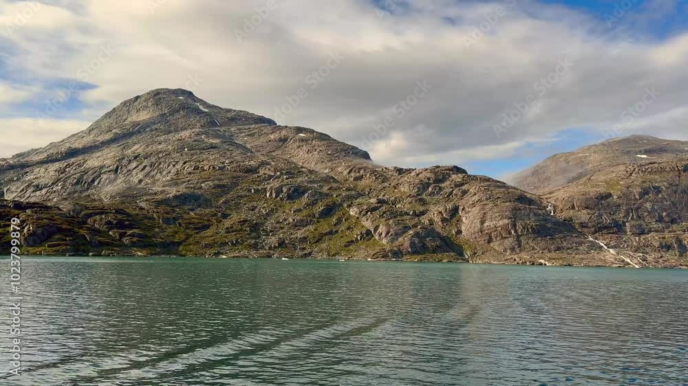 Scenic landscape view from a cruise ship sailing up a fjord in Prince Christian Sound in southern Greenland Scenic landscape view from a cruise ship sailing up a fjord in Prince Christian Sound in southern Greenland