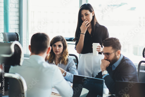 Confident male and female business owners discussing trade accounting and management strategy for company, young group of people in formal wear collaborating together during teamwork in office photo