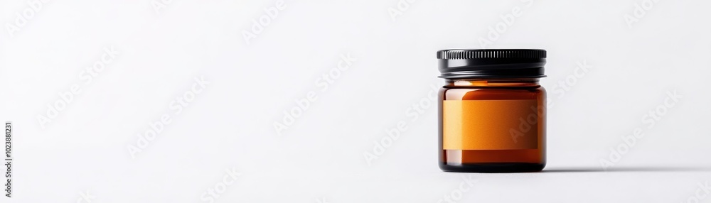 Amber glass jar with black lid on a white isolated background. Amber glass jar with black lid on a white isolated background.
