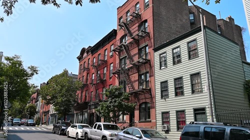 New York, USA, August 15, 2024. Static footage of an iconic cityscape: a red brick Brooklyn building with the classic fire escapes on the facade.
