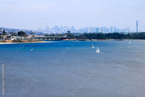 Cityscape of city of San Diego as seen from north side of Mission Bay, California in Summer photo