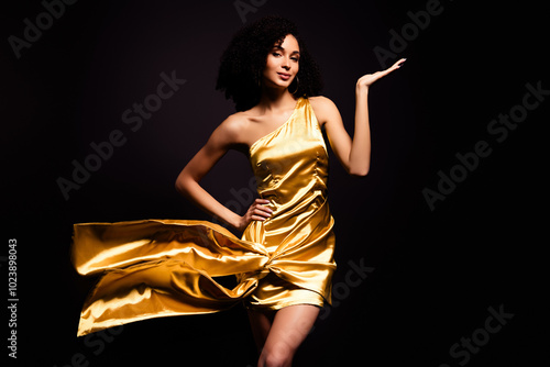 Obraz na plátně Photo of fancy sendual lady wear gold dress dancing erotic moves isolated black