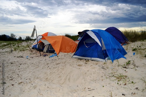 Tents of different colors set up on a beach in the city of Cananeia in São Paulo, Brazil photo