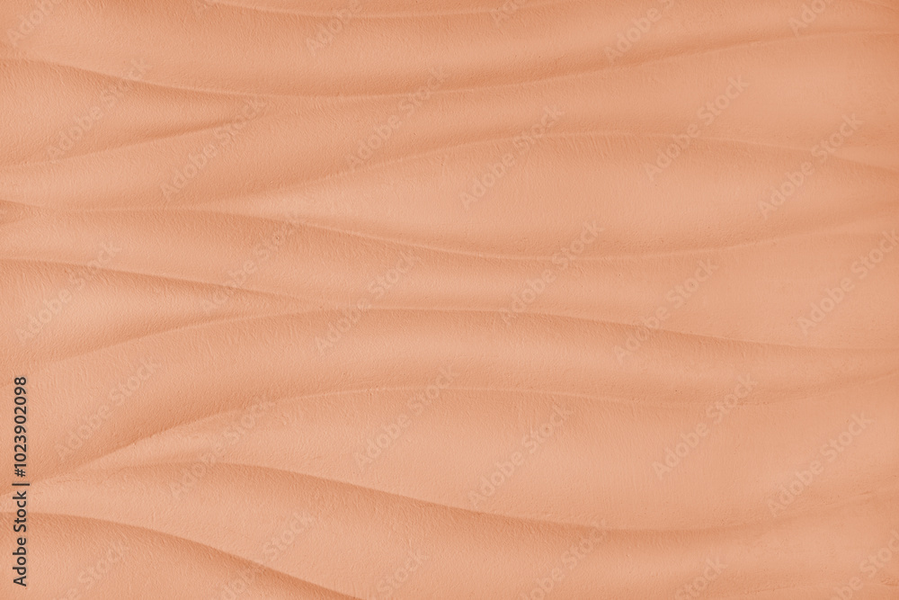 Plaster wall with volumetric relief surface wavy form pattern, orange gypsum texture panel. Interior decoration, design element. Wallpaper,background, backdrop, copy space Plaster wall with volumetric relief surface wavy form pattern, orange gypsum texture panel. Interior decoration, design element. Wallpaper,background, backdrop, copy space