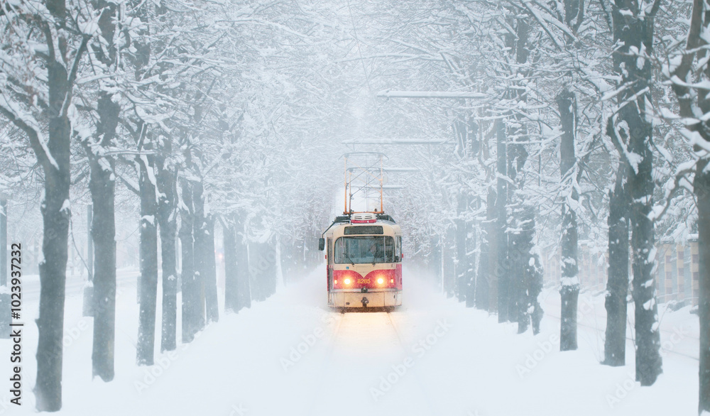 An old red tram runs in winter An old red tram runs in winter