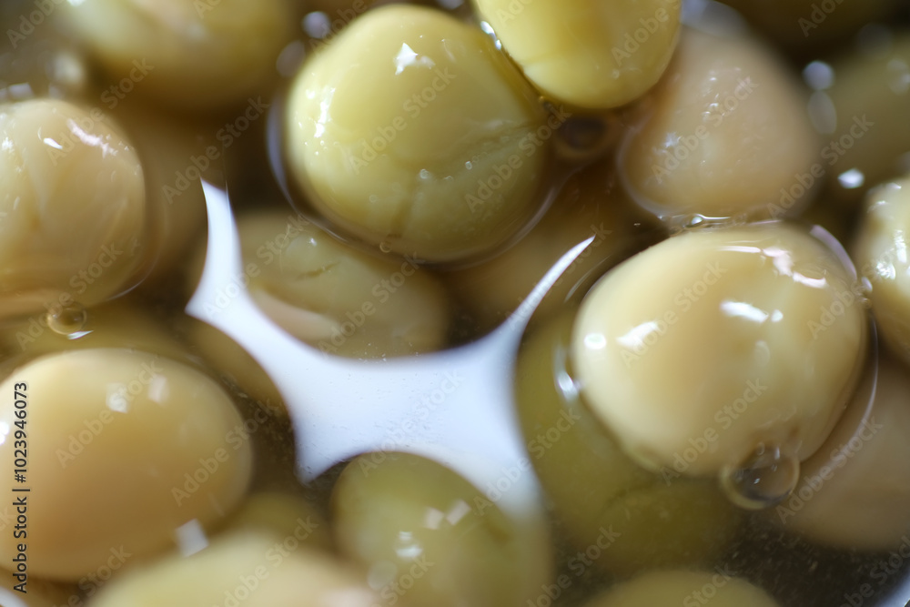 Macro shot of processed peas in the can Macro shot of processed peas in the can
