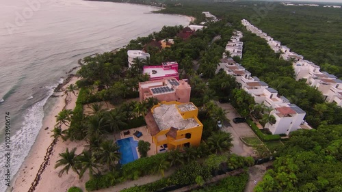 Aerial view showcasing a luxury resort along the beach in mexico, highlighting the stunning coastline and turquoise waters