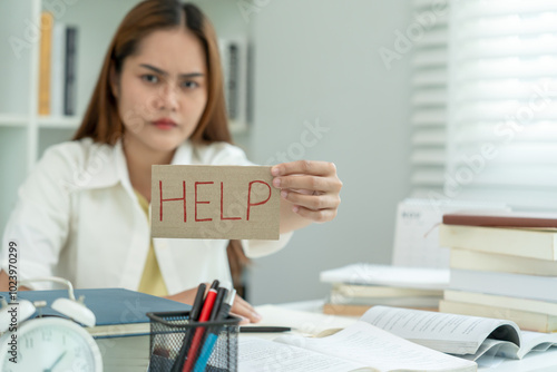 Asian student man have anxiety because of exams, male prepare for test and learning lessons in the library. stress, despair, haste, misunderstanding reading, discouraged, expectation, knowledge, tired photo