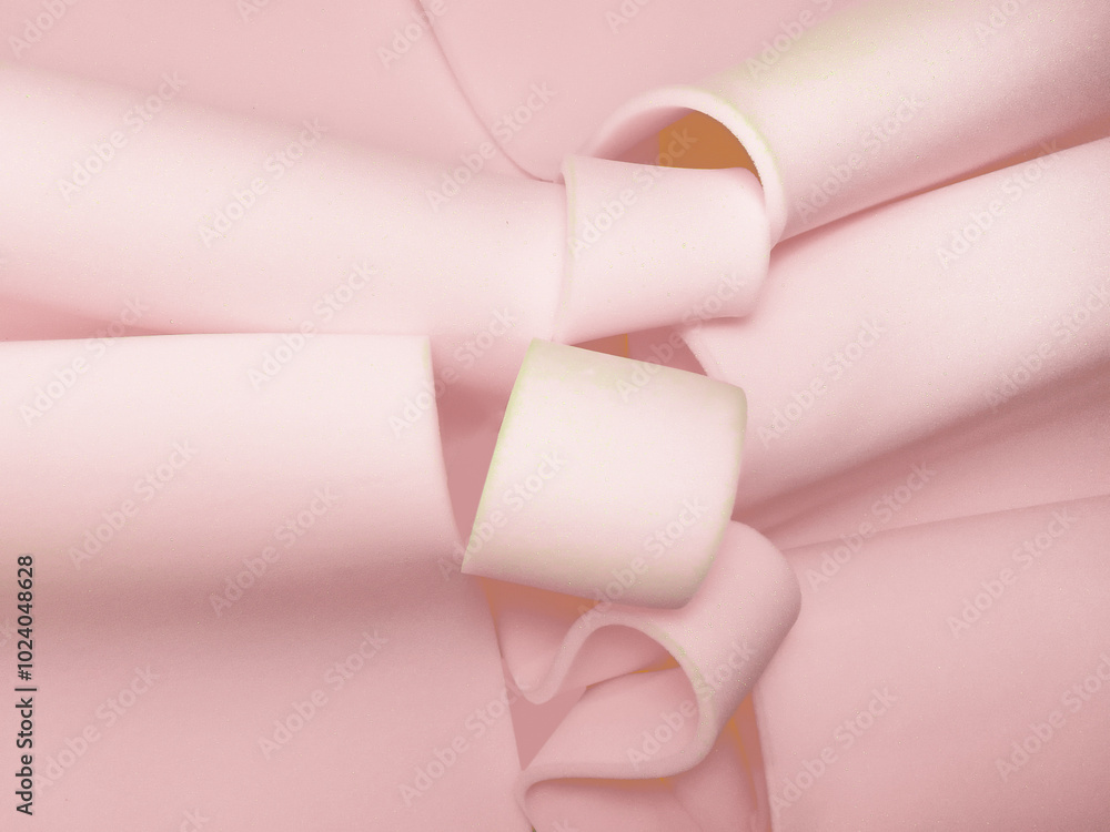 pieces of thin pink foam sponge. a pile of material rolled in a spiral shape pieces of thin pink foam sponge. a pile of material rolled in a spiral shape