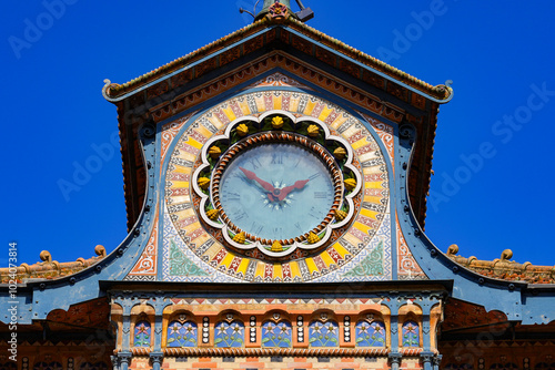 Clock in a roof dormer on the facade of the Saulnier watermill in the former Menier Chocolate Factory in Noisiel, Paris Region, France photo