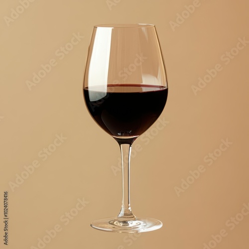 A glass of red wine half full
