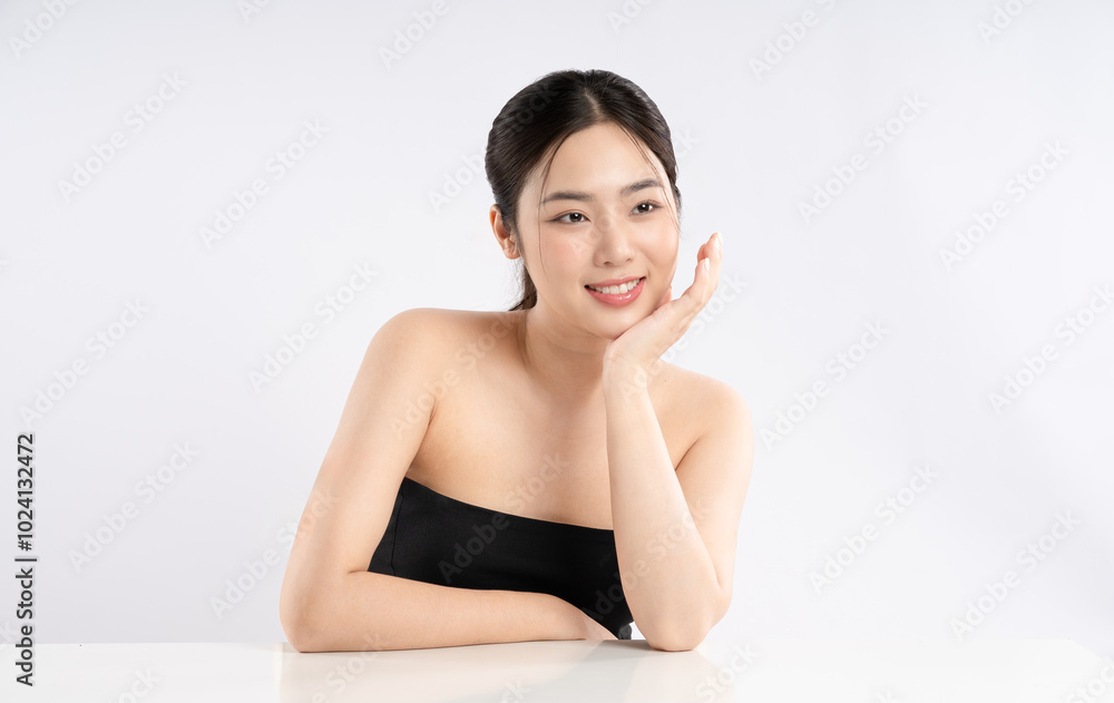 Portrait of a beautiful Asian girl posing for beauty on a white background Portrait of a beautiful Asian girl posing for beauty on a white background