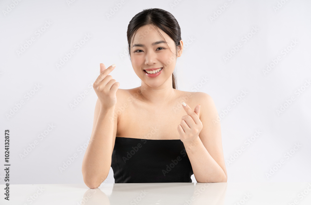 Portrait of a beautiful Asian girl posing for beauty on a white background Portrait of a beautiful Asian girl posing for beauty on a white background