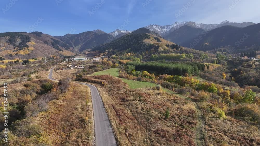 Picturesque mountain slopes covered with autumn forest in the outskirts of the Kazakh city of Almaty Picturesque mountain slopes covered with autumn forest in the outskirts of the Kazakh city of Almaty