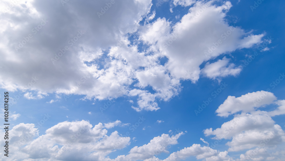 Fototapeta premium clear blue sky background,clouds with background, Blue sky background with tiny clouds. White fluffy clouds in the blue sky. 