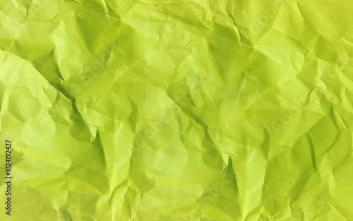 Realistic crumpled paper texture vector. Isolated rough grunge old blank. Bright green isolated realistic crumpled poster.