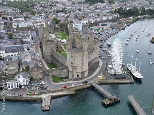 Aerial view of the ancient Caernarfon Castle in North Wales. The castle is currently undergoing repair work and was used for the investiture of Prince's of Wales. photo