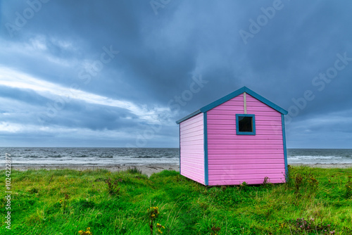 Colorful Beach huts at Mull of Kintyre, Scotland photo