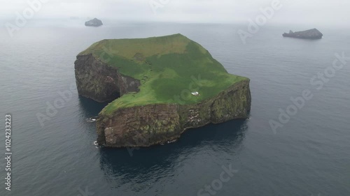 Aerial Footage of an isolated and deserted island in Iceland with a house/cottage. Filmed with a Drone. Different shots available in my portfolio.
