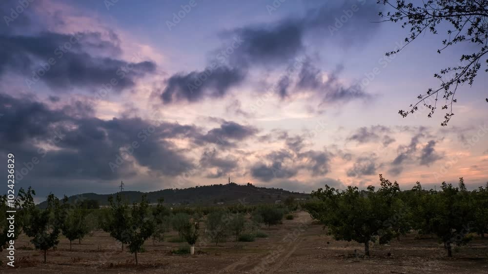 Captivating time-lapse of Bullas: Dusk over arid landscape and drifting clouds Captivating time-lapse of Bullas: Dusk over arid landscape and drifting clouds