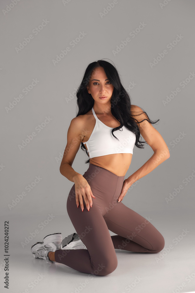 Obraz premium Young girl practice balance asanas isolated on white background. Concept of healthy life and natural balance between body and mental development. Full length