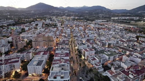 Urban landscape seen from above at twilight with city structures and beautiful lighting below. San Pedro Alcantara, Marbella, Malaga, Andalucia, Spain